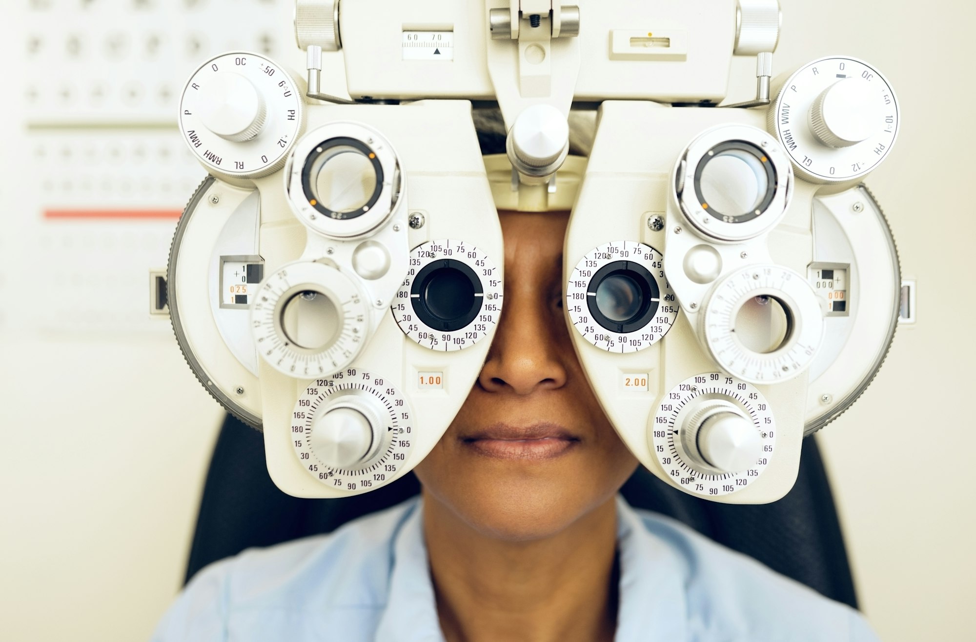 Eye test, face or woman consulting to help eyesight at optometrist for a optical assessment. Optome